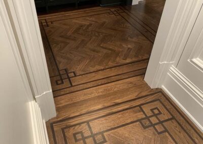 Projects | Tamalpais Hardwood Floors | Select White Oak and Herringbone motif with 3 board border inlay.